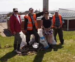 BHMET Volunteers who helped with the beach clean up: (l-r) Lex Beal, Brian Sheppard, Estelle Leask and Tracker Black.